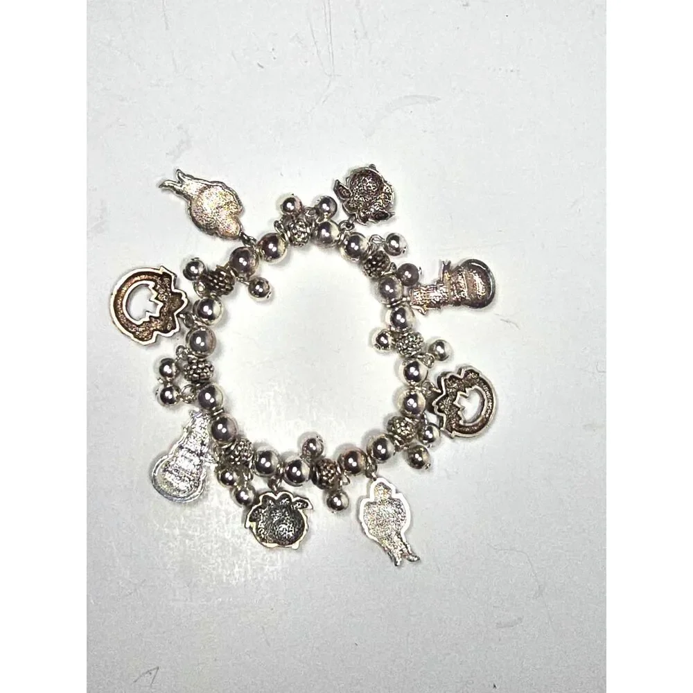 Avon Christmas Charm Bracelet Silver Tone Stretch Santa Snowman Wreath Jewelry